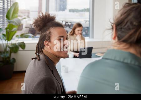Smiling man in office Stock Photo