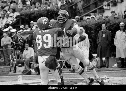 FILE - In this Jan. 11, 1970, file photo, Kansas City Chiefs quarterback  Len Dawson (16) holds the ball as Mo Moorman blocks Minnesota Viking's  defensive tackle Gary Larson (77) during the