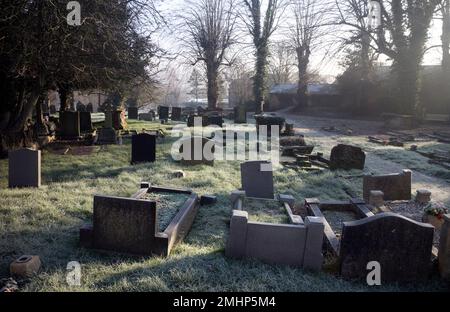 Holy Cross churchyard in winter, Daventry, Northamptonshire, England, UK Stock Photo