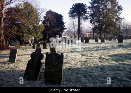 Holy Cross churchyard in winter, Daventry, Northamptonshire, England, UK Stock Photo