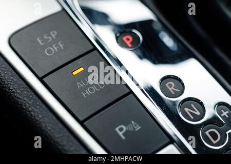 Auto hold button in a modern vehicle turned on Stock Photo