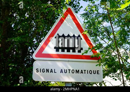 signal automatique french text means automatic signal road sign railway crossing ahead Stock Photo