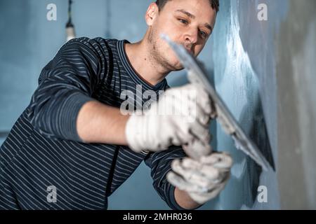 application of insulation to the wall against moisture and water Stock Photo
