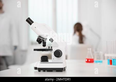 Modern microscope on white table in laboratory. Medical research Stock Photo