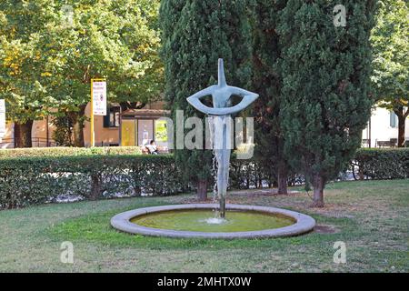 GREVE IN CHIANTI, ITALY - SEPTEMBER 15, 2018: This is a modern fountain in a public garden next to the Basilica of Santa Croce. Stock Photo