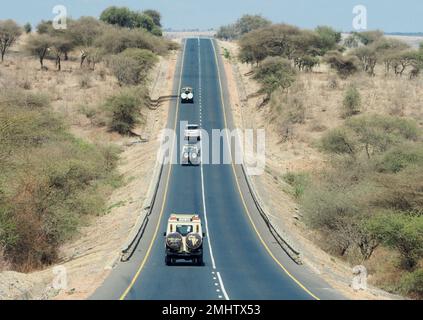 Nanja, Tanzania. 21st Sep, 2022. Cars drive on a straight two-lane road. Credit: Soeren Stache/dpa/Alamy Live News Stock Photo