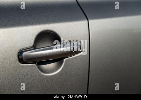 Car door handle with unlock button. keyless entry car door handle with touch sensor Stock Photo