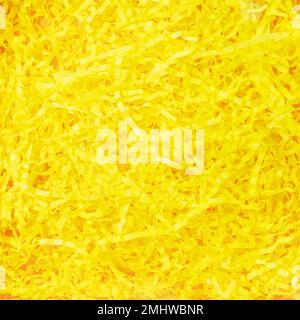 Texture of yellow paper filler. Shredded Paper Packing Material. Sunny yellow spaghetti shredded packing paper used to protect fragile object while in Stock Photo