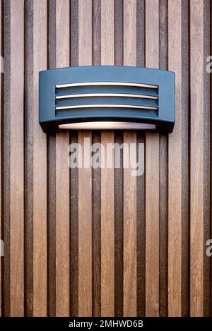 Modern wall lamp on the wall covered with decorative pvc isolation material Stock Photo