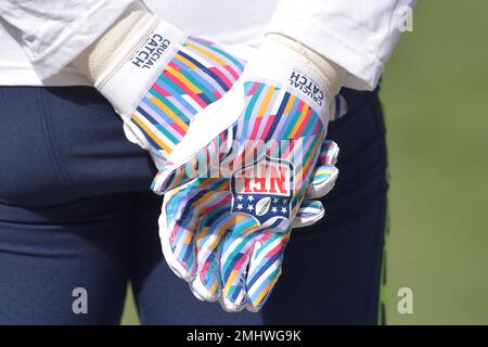 A general view of the gloves featuring the Crucial Catch logo of Seattle Seahawks defensive end Ezekiel Ansah before an NFL football game against the Cleveland Browns Sunday Oct. 13 2019 in Cleveland....