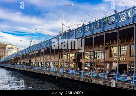 Istanbul Turkey January 22, 2023, Fishermen catch fish on the Galata Bridge, many fishermen daily on the bridge. Stock Photo