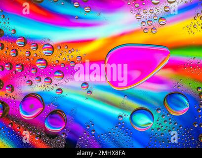 Water drops over a colorful abstract background Stock Photo