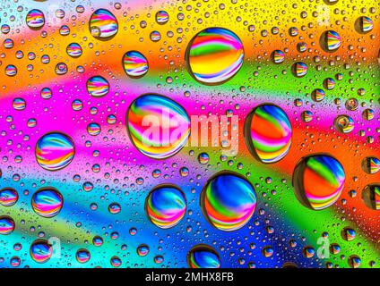 Water drops over a colorful abstract background Stock Photo
