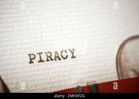 Piracy word written with a typewriter. Stock Photo