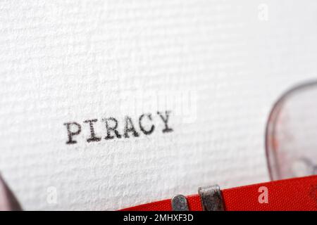 Piracy word written with a typewriter. Stock Photo