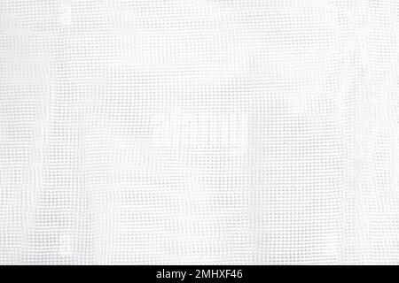 White mesh texture. Fabric for sewing, decoration or household needs. Square shape. Grid Stock Photo