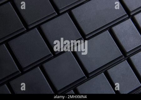 Black computer keyboard, macro photo, selective focus. Place for text on keyboard button. Stock Photo