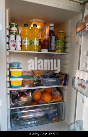 Inside view of a fridge with various food and drinks on view Stock Photo