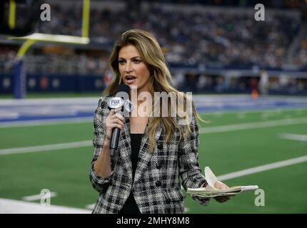 A FOX Sports employee holds a sound dish on the sideline during an NFL football  game between the Green Bay Packers and Dallas Cowboys on Sunday, Oct. 8,  2017, in Arlington, Texas. (