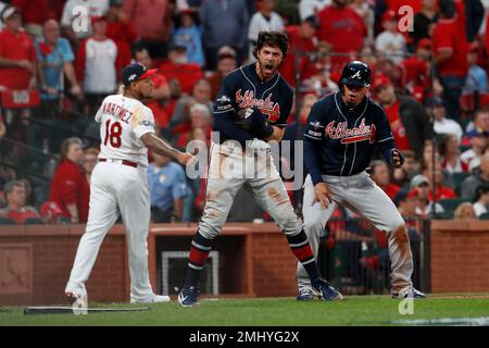 Dansby Swanson #7 of the Atlanta Braves looks on from third base during a  pitching change in the sixth inning during MLB g…