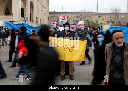 Tehran, Tehran, Iran. 27th Jan, 2023. An Iranian man holds a placard written ''Obedient to the command of my supreme leader'' during a protest against the burning of a Koran in Stockholm after performing Friday prayer at Imam Khomeini Mosque in Tehran, Iran, on January 27, 2023. Swedish-Danish far-right politician Rasmus Paludan set fire to a copy of the Muslim holy book in front of Turkey's embassy in the Swedish capital. Many Muslim countries have said they were outraged by the burning of the Koran, which Swedish Prime Minister Ulf Kristersson condemned as ''deeply disrespectful' (Credit I C Stock Photo