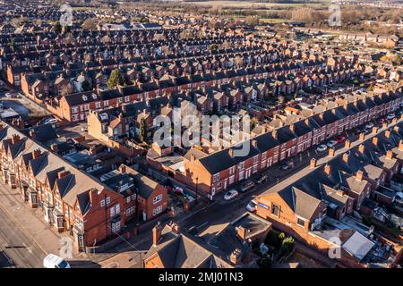 An aerial view of the rooftops of rows of back to back terraced houses in a working class area of a Northern town in England Stock Photo