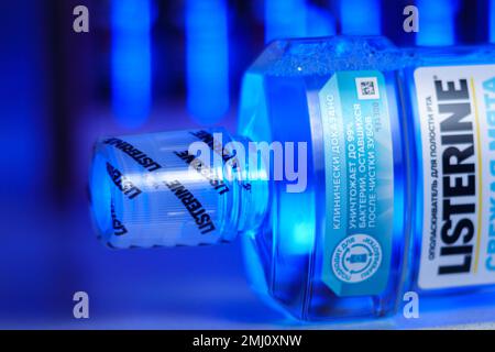 Tyumen, Russia-October 14, 2022: Listerine is a brand of antiseptic mouthwash product, blue background, selective focus Stock Photo