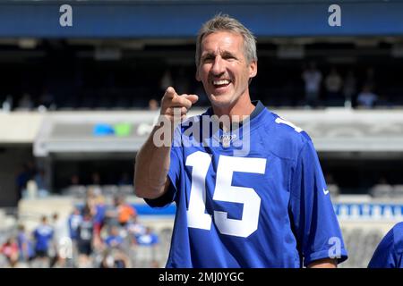 New York Giant quarterback Jeff Hostetler threads his way through Phoenix  Cardinals defenders on his way to a 19 yard touchdown during the first  quarter of their game in Tempe, Arizona Sunday