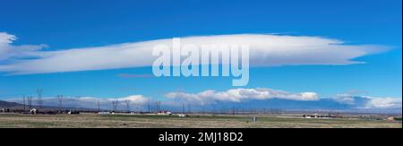 Large lenticular cloud shown looking west in Lancaster, California, United States. Stock Photo