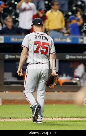 New York Mets shortstop Luis Guillorme (13) and Pete Alonso, right, tear  the jersey off teammat …