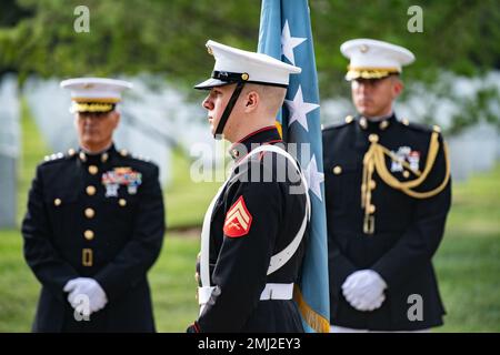 A personal color bearer carries the Medal of Honor flag during military funeral honors with funeral escort for Medal of Honor recipient U.S. Marine Corps Sgt. Maj. John Canley in Section 60 of Arlington National Cemetery, Arlington, Va., Aug. 25, 2022.     Canley was awarded the Medal of Honor in 2018 for his actions during the battle of Hue City, Vietnam in 1968. As the Company Gunnery Sergeant, Company A, 1st Battalion, 1st Marine, 1st Marine Division, Canley and his Marines fought off multiple vicious attacks while attempting to relieve friendly forces that were surrounded by enemy forces. Stock Photo