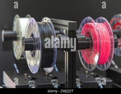 Plastic Threads on Rolls 3d Printer Filament Reel Holder Stock Photo