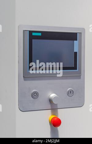 Large Touch Screen Machine Control With Emergency Stop Button Stock Photo