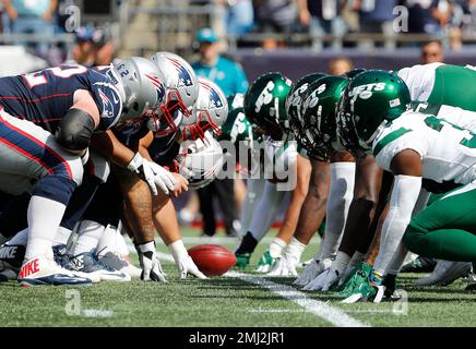 The New England Patriots, wearing their throwback uniforms, and the Detroit  Lions line up for the snap at the line of scrimmage during an NFL football  game at Gillette Stadium, Sunday, Oct.