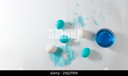 Process of painting Easter eggs with natural dye of blue color Stock Photo