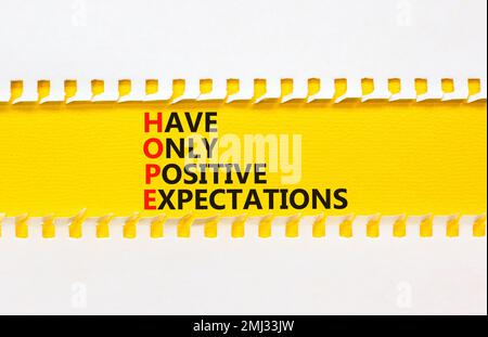 HOPE have only positive expectations symbol. Concept words HOPE have only positive expectations on paper on beautiful white background. Business HOPE Stock Photo