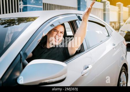 Driver man yelling at driver while driving, Impatient driver yelling. Angry driver yelling at another driver. shouting impatient driver concept Stock Photo