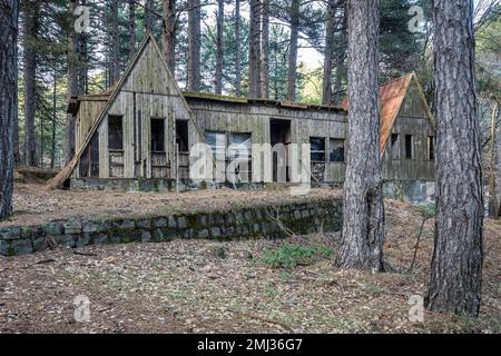 An empty and derelict hut in an old abandoned ski resort in the woods on Mount Etna, Sicily, Italy Stock Photo