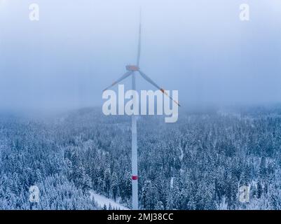 Windmill in the forest in fog and snow, Freudenstadt, Black Forest, Germany Stock Photo