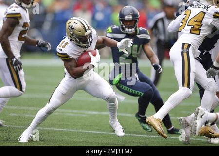 New Orleans Saints' Deonte Harris (11) runs back a punt against the Tampa  Bay Buccaneers during …