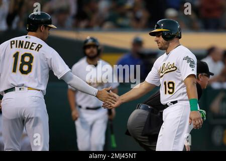 St. Petersburg, United States. 14th Apr, 2022. St. Petersburg, FL. USA;  Oakland Athletics center fielder Cristian Pache (20) and left fielder Chad  Pinder (10) chest bump during pregame warmups prior to a