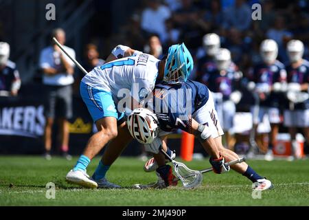 IMAGE DISTRIBUTED FOR PREMIER LACROSSE LEAGUE - Archers midfielder Austin  Sims (18) is defended by Atlas defender Kyle Hartzell (81)during a Premier  Lacrosse League game on Friday, June 28, 2019 in Atlanta. (