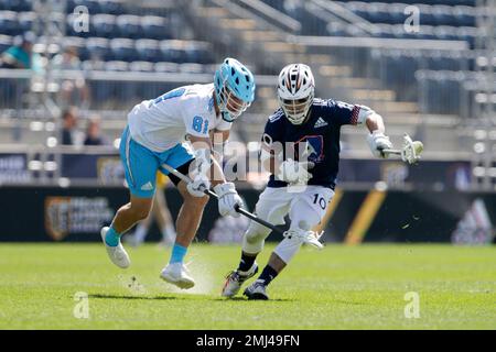 IMAGE DISTRIBUTED FOR PREMIER LACROSSE LEAGUE - Archers midfielder Austin  Sims (18) is defended by Atlas defender Kyle Hartzell (81)during a Premier  Lacrosse League game on Friday, June 28, 2019 in Atlanta. (