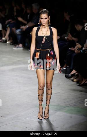 Bella Hadid wears a creation as part of the Versace Fall/Winter 2022-2023  fashion collection, unveiled during the Fashion Week in Milan, Italy,  Friday, Feb. 25, 2022. (AP Photo/Antonio Calanni Stock Photo - Alamy