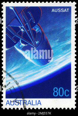 AUSTRALIA - CIRCA 1986: A Stamp printed in AUSTRALIA shows the AUSSAT Satellite in Orbit, Earth's Surface, AUSSAT National Communications Satellite Sy Stock Photo