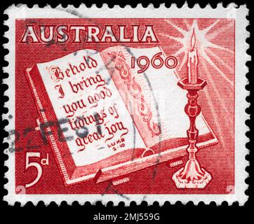 AUSTRALIA - CIRCA 1960: A Stamp printed in AUSTRALIA shows the Open Bible and Candle, circa 1960 Stock Photo