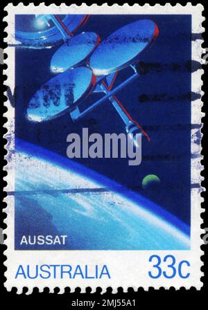 AUSTRALIA - CIRCA 1986: A Stamp printed in AUSTRALIA shows the AUSSAT Satellite, Moon and Earth's Surface, AUSSAT National Communications Satellite Sy Stock Photo