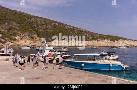 BISEVO ISLAND, CROATIA, EUROPE - Tourists queue for tour of Blue Cave, near island of Vis, in Adriatic Sea. Stock Photo