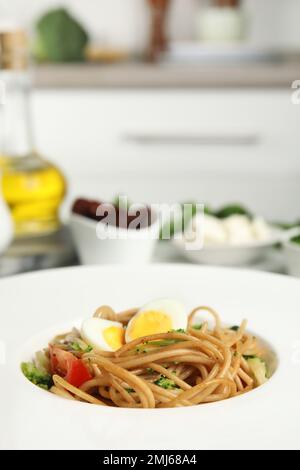 Tasty buckwheat noodles in plate on table, closeup Stock Photo