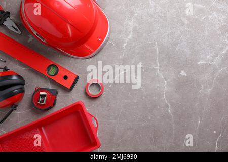 Flat lay composition with different construction tools on grey marble background. Space for text Stock Photo